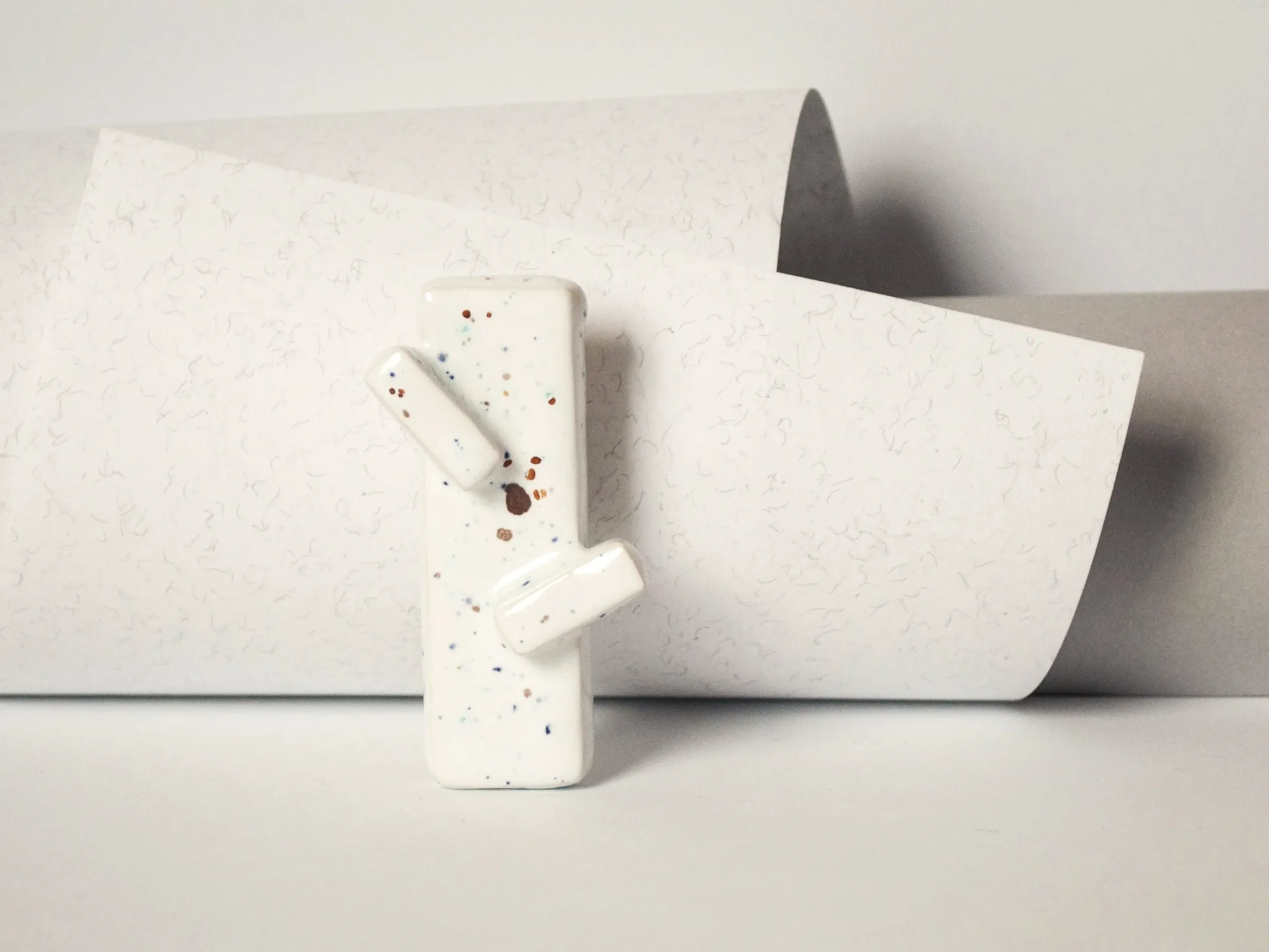 modern minimalist oblong brooch moving upwards clayometry