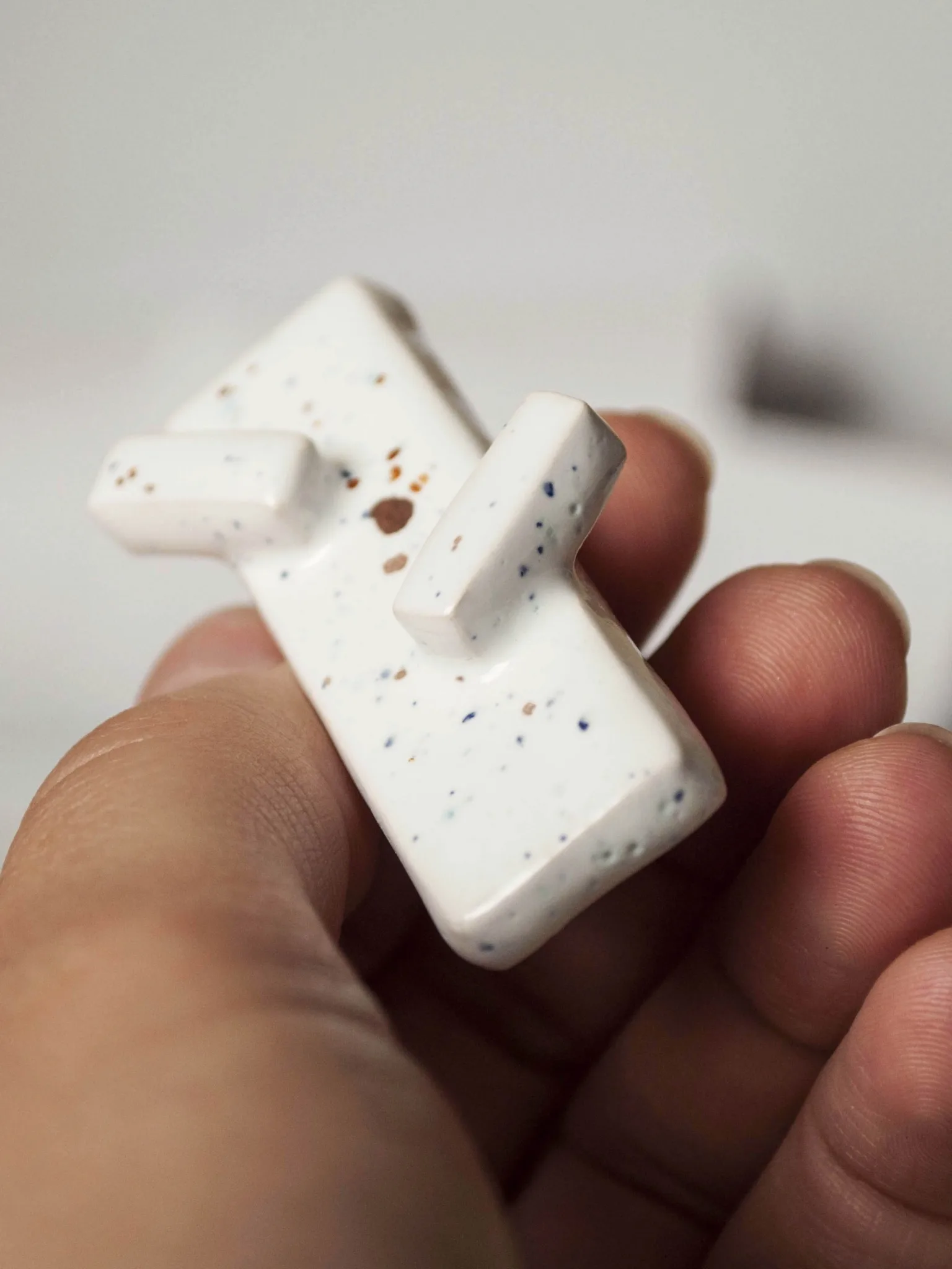 modern minimalist oblong brooch moving upwards clayometry