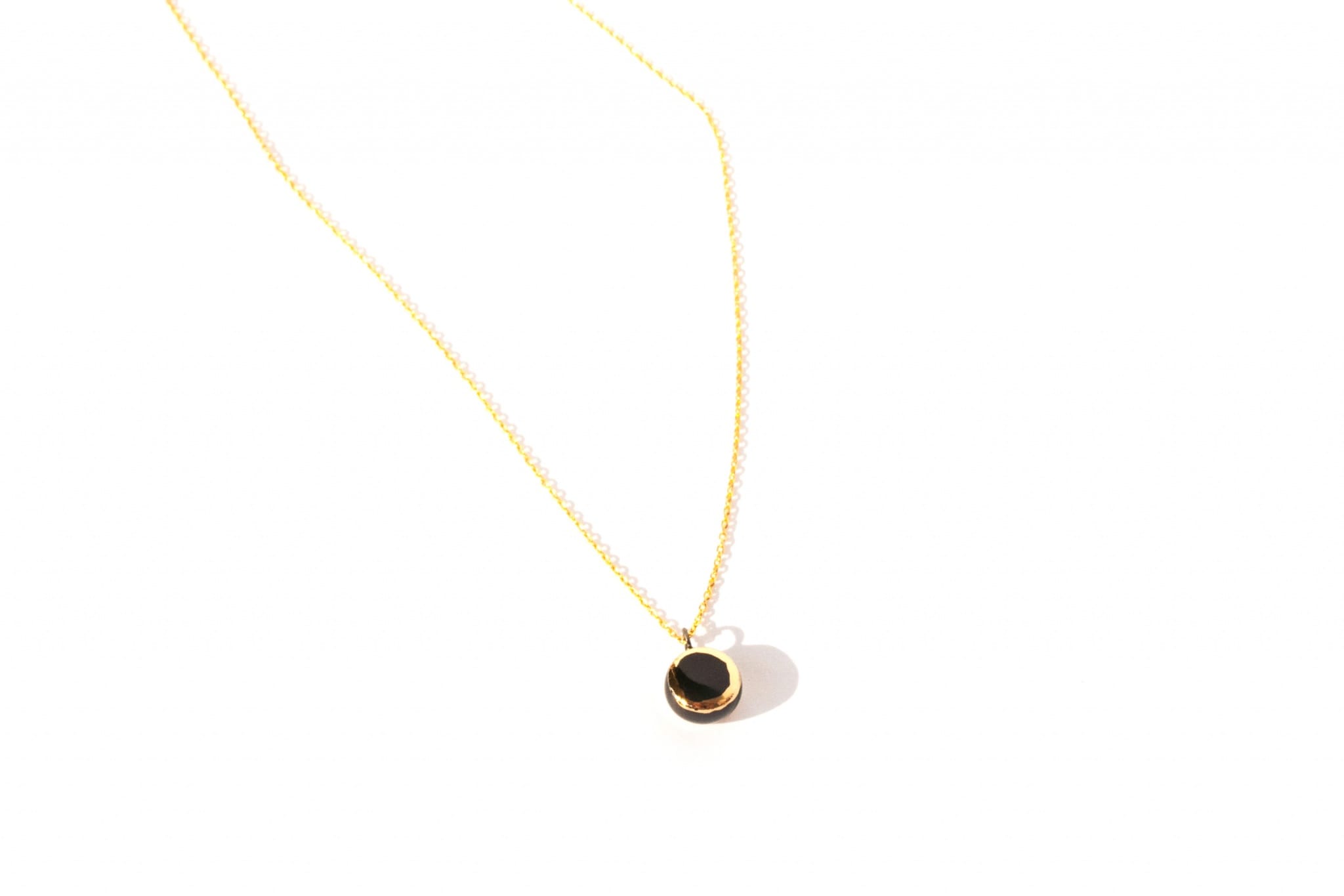 minimalist ceramic pendant golden aureole clayometry