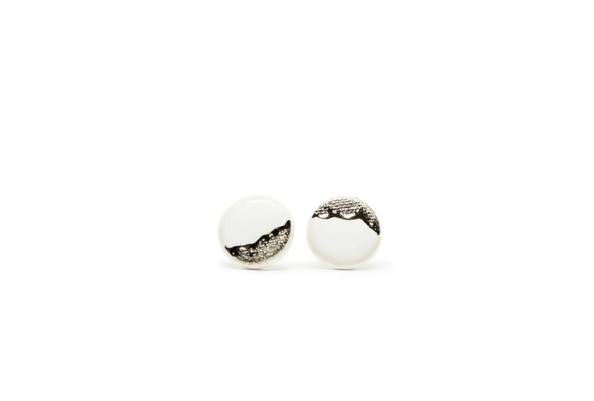 white earrings with platinum coast platinum clayometry