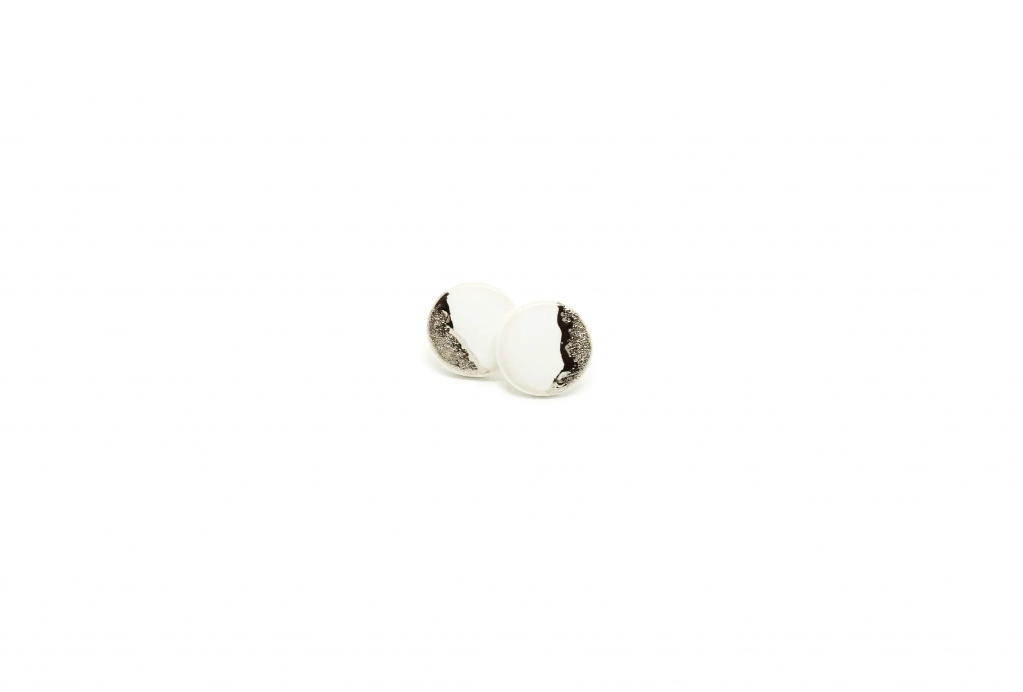 white earrings with platinum coast platinum clayometry