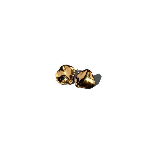 Handmade black porcelain stud earrings with irregular shape and gold luster interior