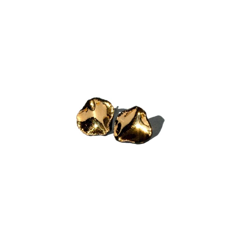 Handmade black porcelain stud earrings with irregular shape and gold luster interior
