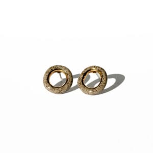 Grey stoneware ring-shaped earrings with clear glossy glaze and gold luster accent