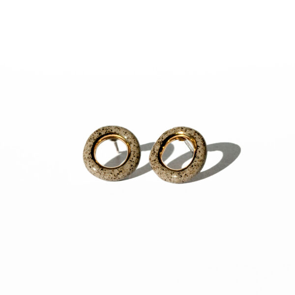 Grey stoneware ring-shaped earrings with clear glossy glaze and gold luster accent
