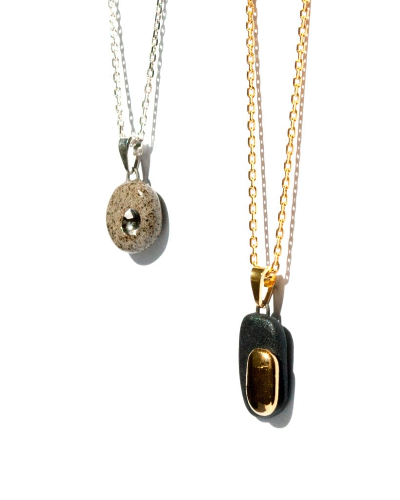 Handmade black porcelain pendant necklace with two-layer design, matte and glossy finishes, gold luster decoration, and gold-plated sterling silver chain and bail