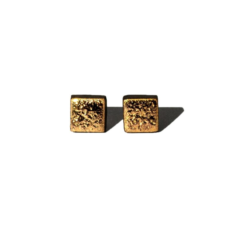 Square handmade ceramic earrings with moon-textured black clay and 24k gold luster accents