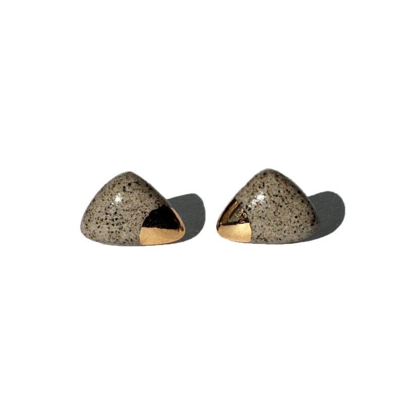 Handmade grey stoneware triangular stud earrings with rounded corners, clear glossy glaze, gold luster accents, and sterling silver posts