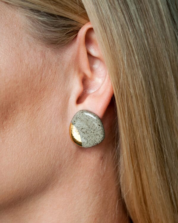 Minimalist ceramic earrings made from grey stoneware clay with gold luster accents