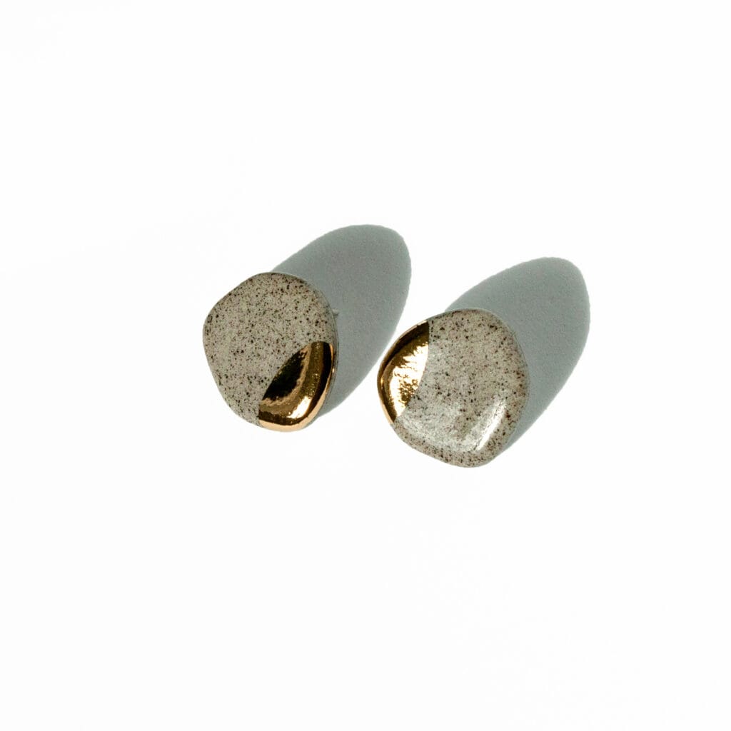 Minimalist ceramic earrings made from grey stoneware clay with gold luster accents