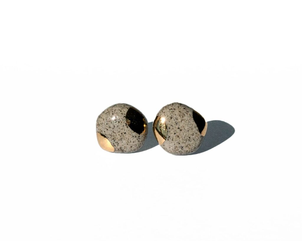 Small organic grey stoneware earrings with glossy glaze and gold luster accents