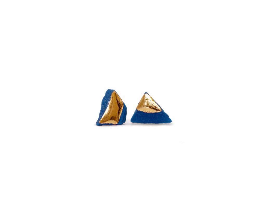 Blue Smithereens Small ceramic stud earrings in blue porcelain with gold luster finish, front view