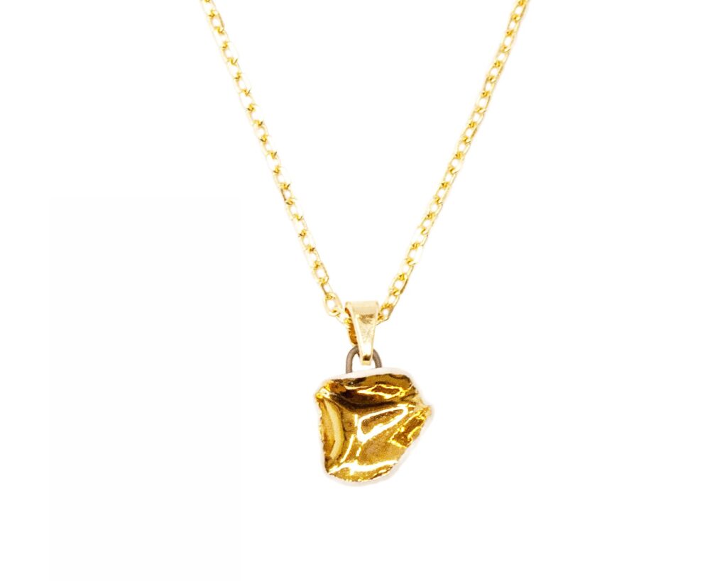 White Matter Small ceramic pendant necklace in white porcelain with gold luster finish, front view