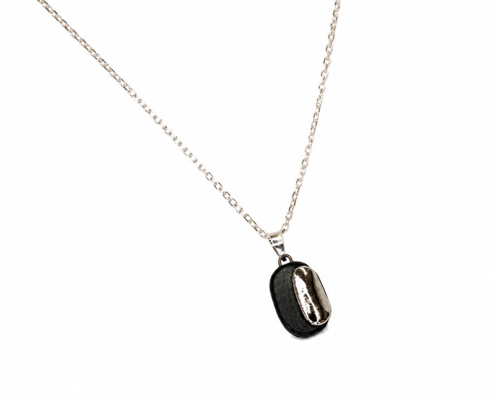 Handmade black porcelain pendant necklace with two-layer design, matte and glossy finishes, platinum luster decoration, and sterling silver chain