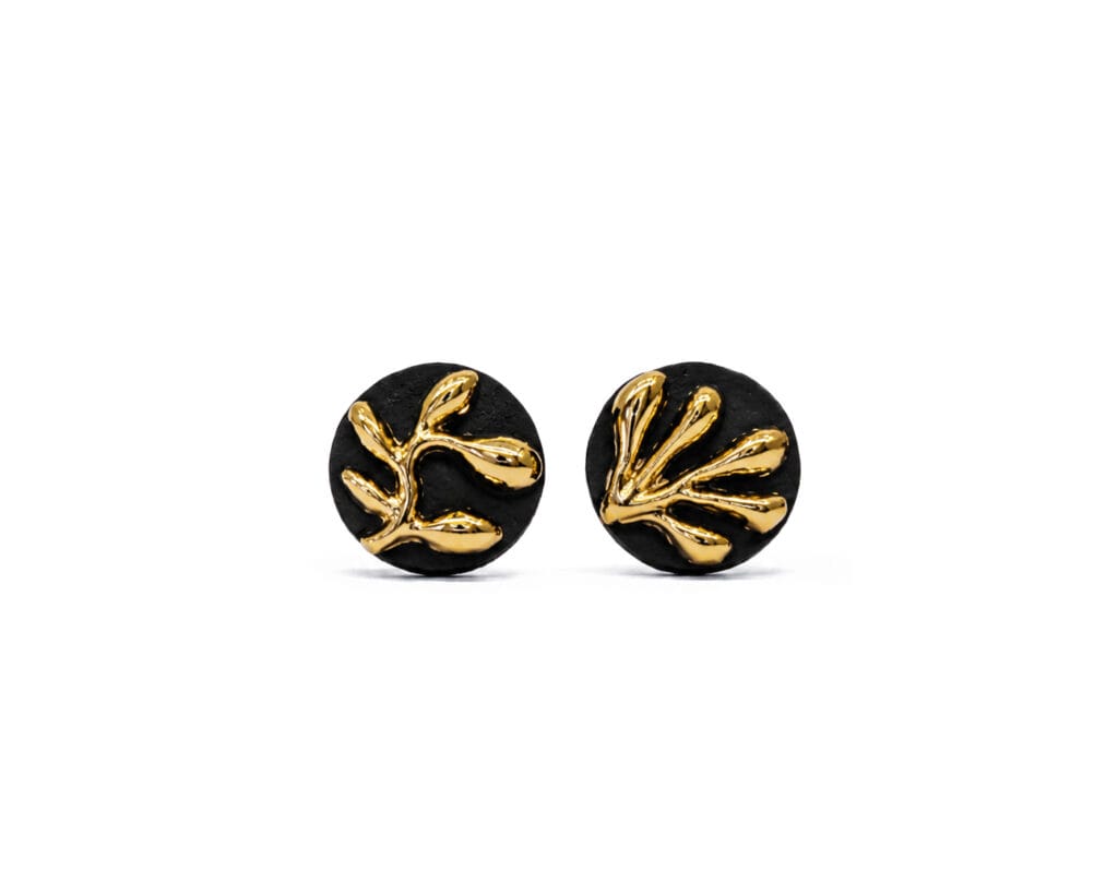 Botanical Relief Gold handmade black porcelain stud earrings with raised botanical relief and gold luster, front view
