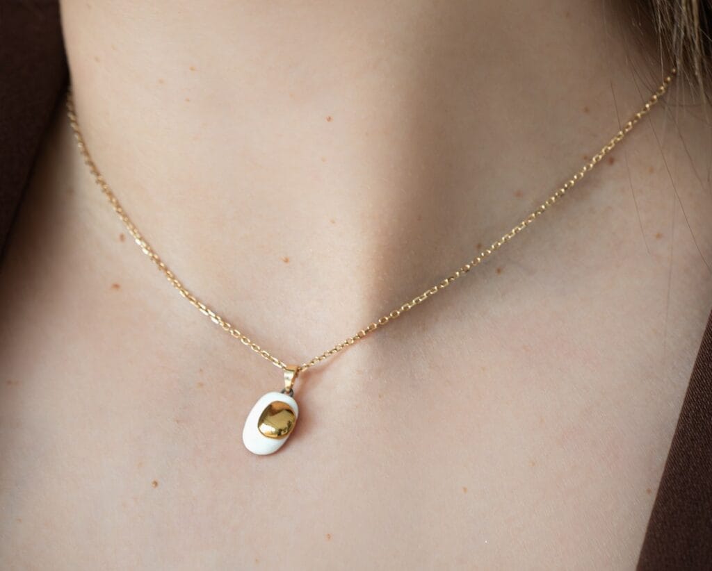 Dual Gold handmade white porcelain pendant necklace close up